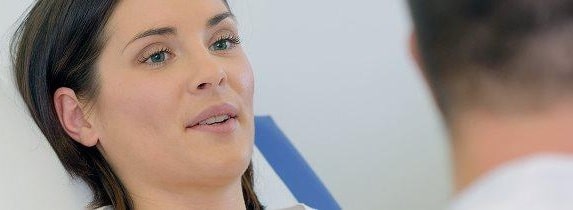 Woman talking to man during conversation